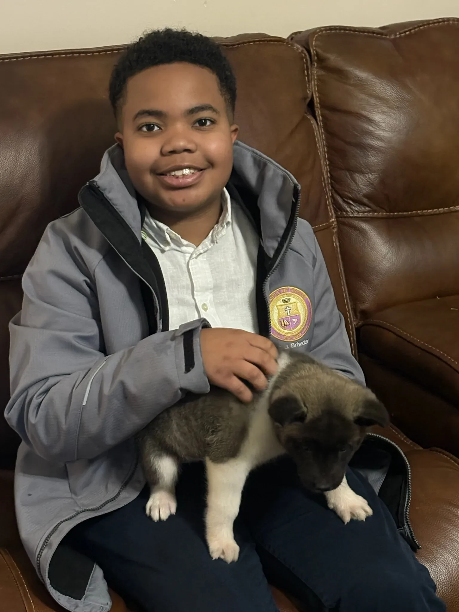 The Briwder family with an Akita puppy